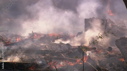 Smoldering ruins of disastrous structure fire