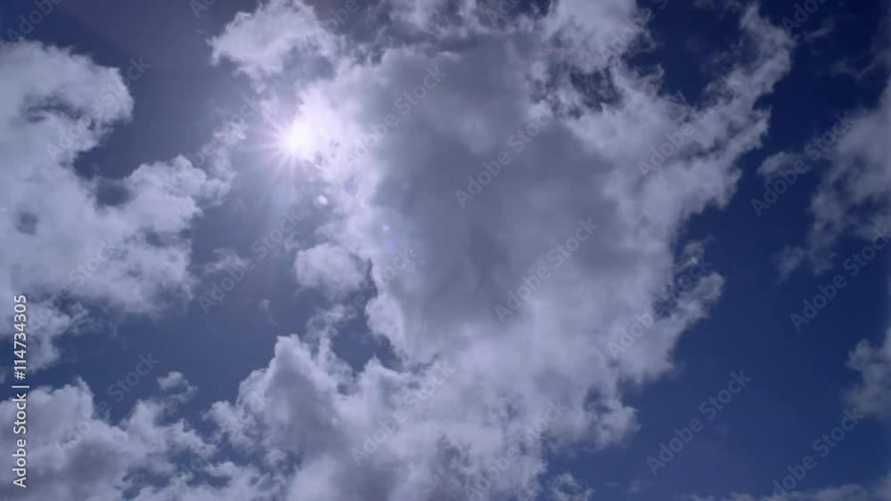 Time-lapse clouds and rayed sun with lens flares Time-lapse clouds and rayed sun with lens flares