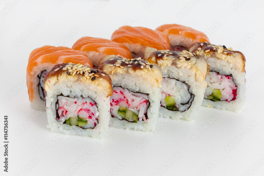 sushi rolls on a white background with salmon, avocado, caviar crab and sesame seeds sushi rolls on a white background with salmon, avocado, caviar crab and sesame seeds