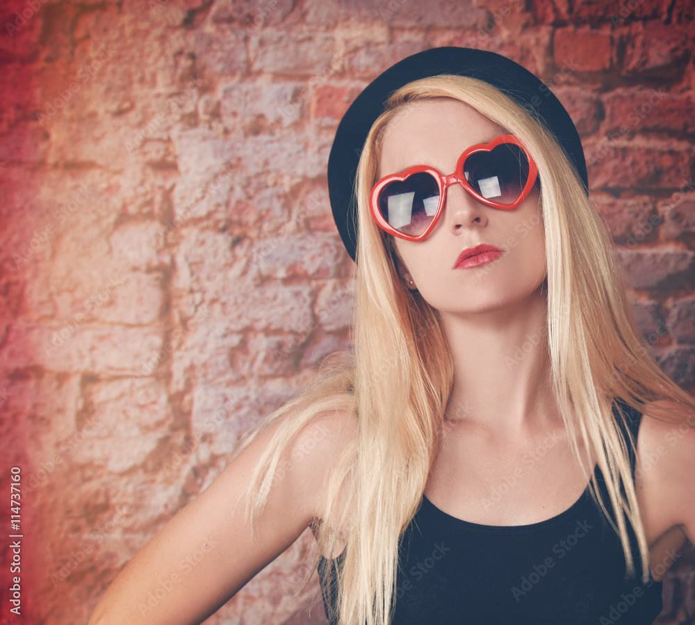 Pretty Fashion Girl with Sunglasses on Brick Wall Pretty Fashion Girl with Sunglasses on Brick Wall