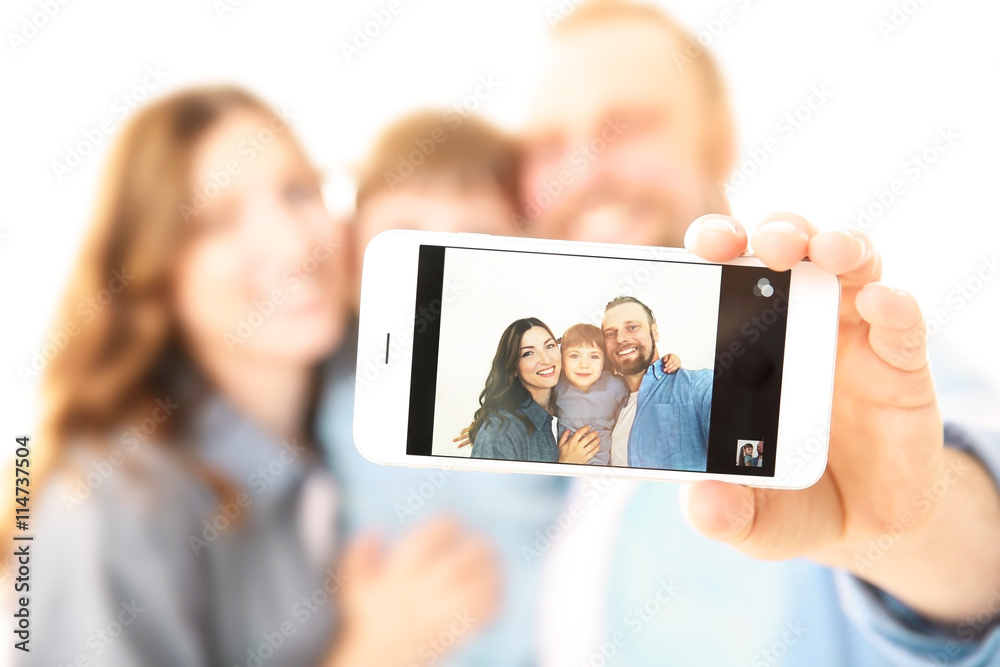 Happy family taking photo of themselves isolated on white