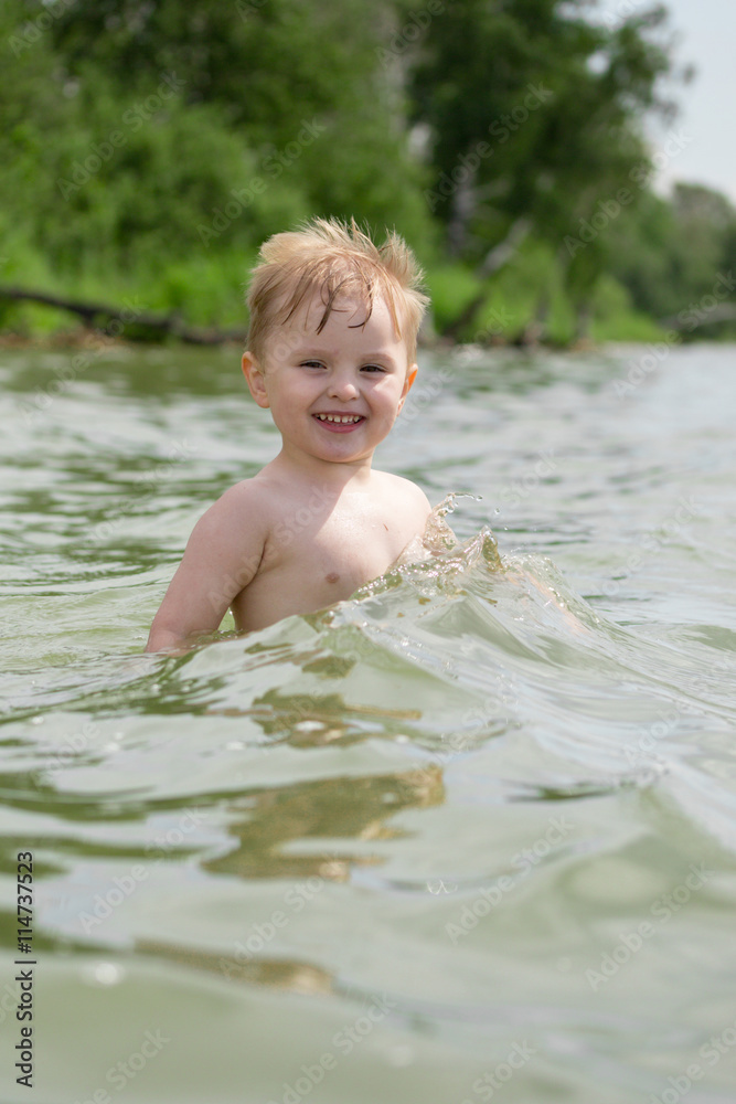 little boy bathes in a lake little boy bathes in a lake
