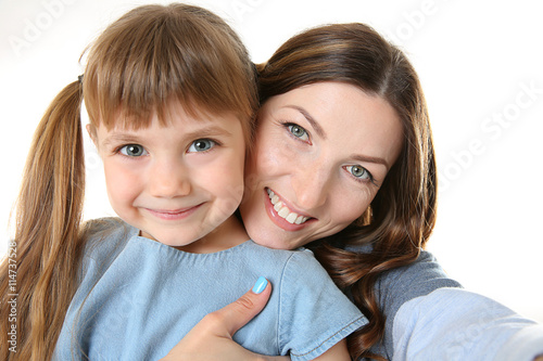 Mother and daughter taking ...