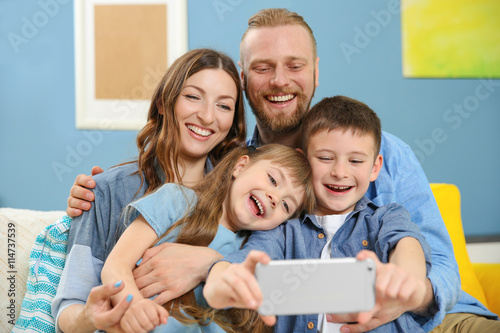 Happy family taking selfie ...