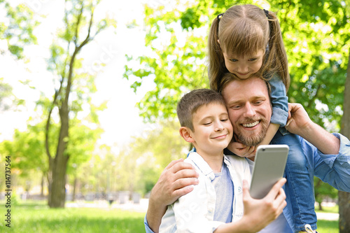 Happy family taking selfie ...