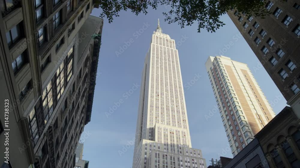 Wide low angle shot of highrise buildings in city / New York, New York, United States
