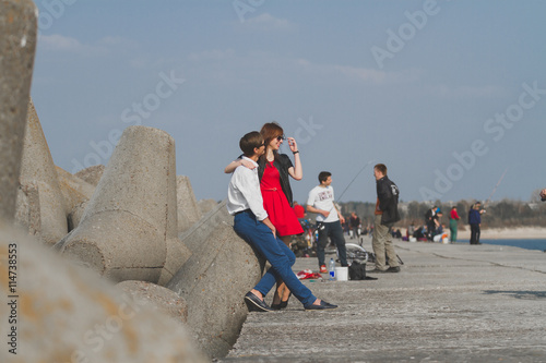 Image of beautiful couple posing on the sea