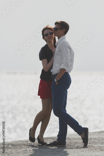 Image of beautiful couple posing on the sea