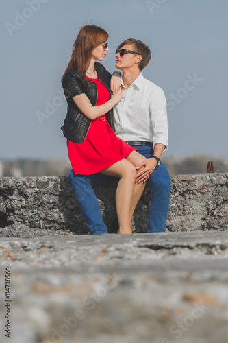Image of beautiful couple posing on the sea