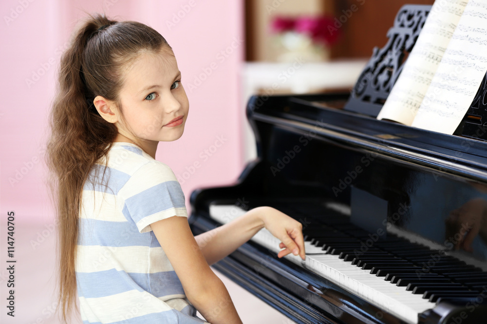 Fototapeta Tired girl playing piano