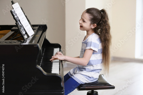 Small girl playing piano