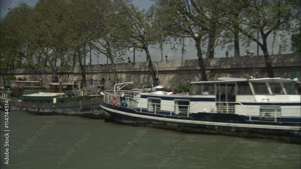 Traveling past boats moored along the Seine, Paris Traveling past boats moored along the Seine, Paris