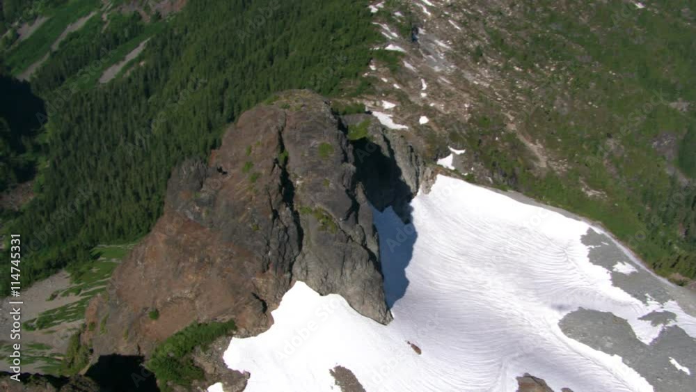 Flight over timbered ridge in Canadian Cascades, British Columbia