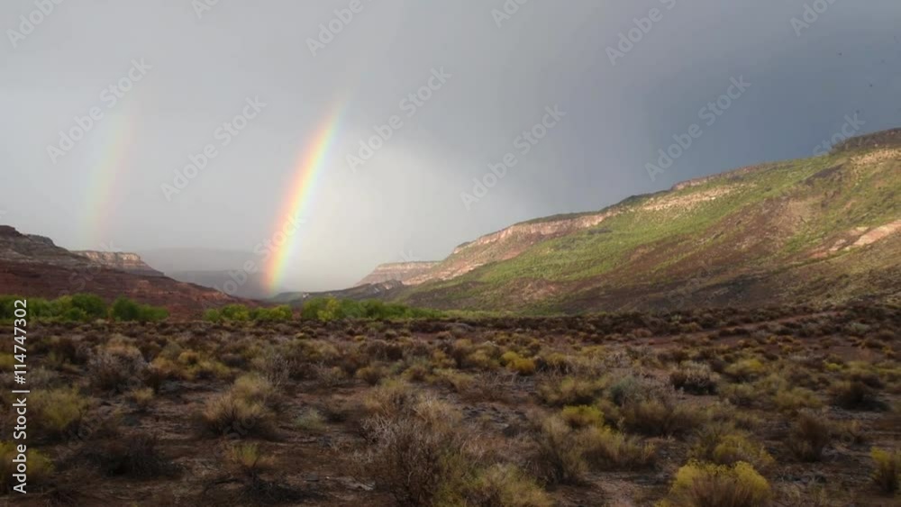 Pan across a desert valley with a rainbow
Pan across a desert valley with a rainbow