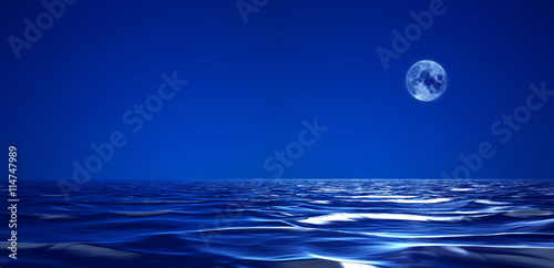 Full moon over cold night water