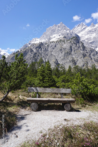 Timber bench with Beautiful rockfall valley of Wimbachgries with