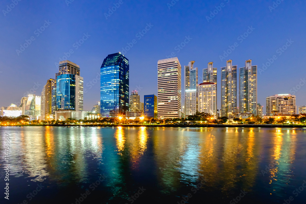 Bangkok city downtown at night with reflection of skyline