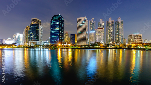 Bangkok city downtown at night with reflection of skyline © panya7