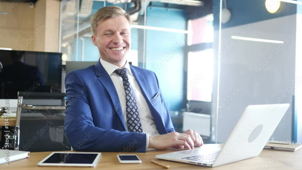 Laughing Businessman In Office Laughing Businessman In Office