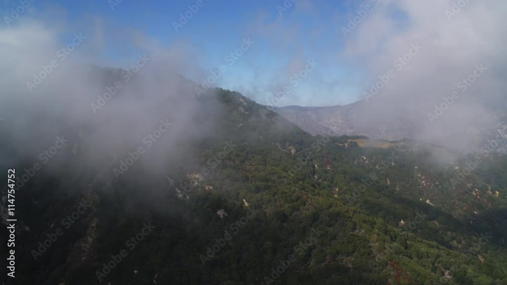 Flying over a misty ridge in Angeles National Forest in the San Gabriel Mountains, California. Shot in 2010. Flying over a misty ridge in Angeles National Forest in the San Gabriel Mountains, California. Shot in 2010.
