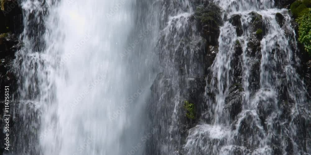 Close view of waterfall section with heavy flow on left Close view of waterfall section with heavy flow on left