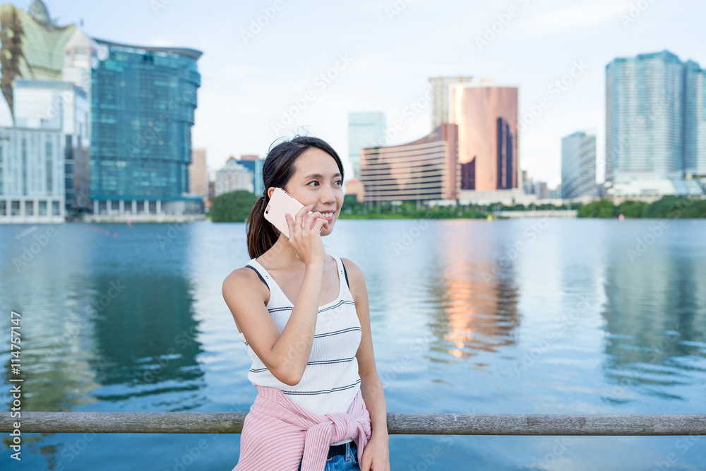 Woman chat on cellphone in Macao