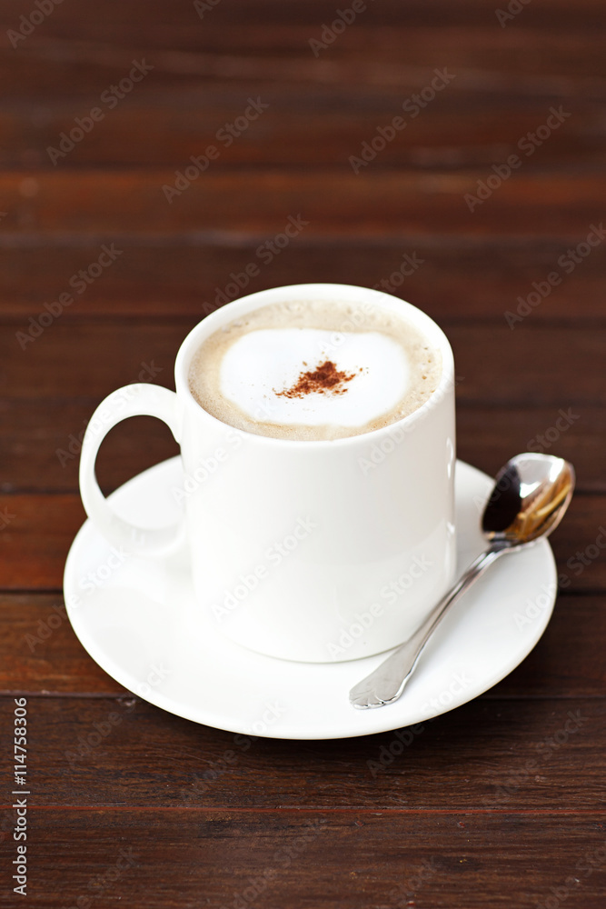 Cup of Cappuccino Coffee On the Wood Table. Cup of Cappuccino Coffee On the Wood Table.