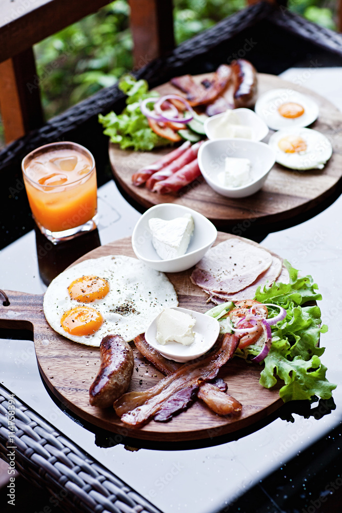 Breakfast - fried egg with bacon and cheese Breakfast - fried egg with bacon and cheese