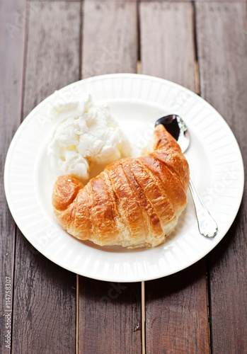 Fresh baked croissants with smug of cappuccino