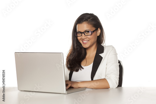 beautiful business woman working on her laptop