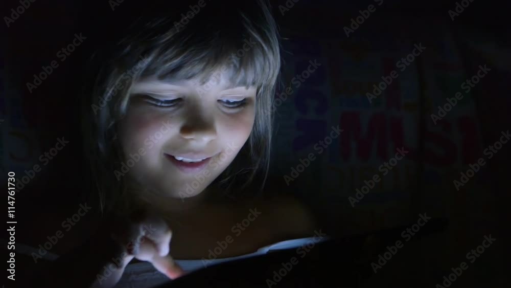 Portrait of Kid Using a Computer in the Night. Portrait of Kid Using a Computer in the Night.