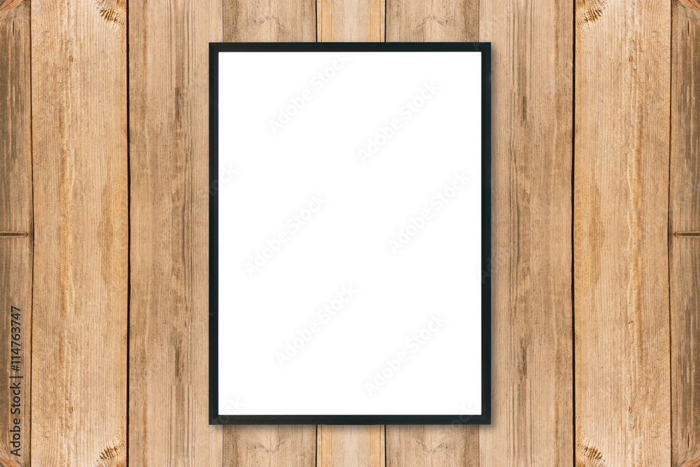 Mock up blank poster picture frame on wood wall.