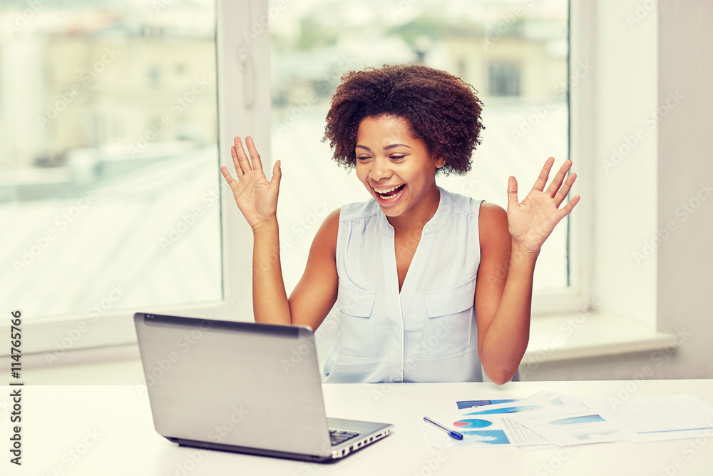 happy african woman with laptop at office happy african woman with laptop at office