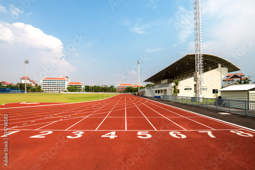 Red running track with numbers photo