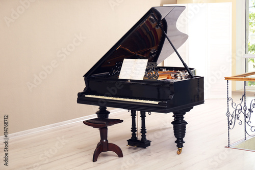 Beautiful black piano in th...
