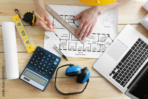 Man working with engineer b...