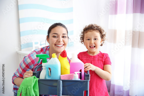 Happy family cleaning home