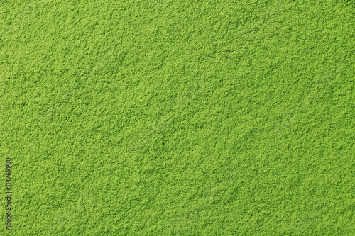 Powdered matcha green tea background, closeup