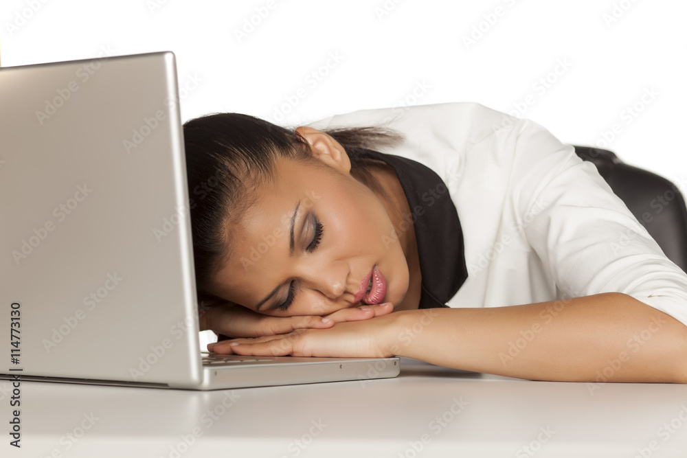 Young beautiful business woman sleeping on her laptop Young beautiful business woman sleeping on her laptop