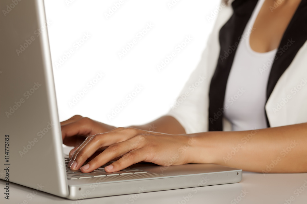 feminine hands typing on a laptop keyboard feminine hands typing on a laptop keyboard