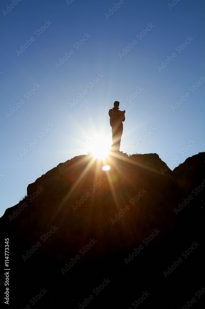 man hill top sun silhouette