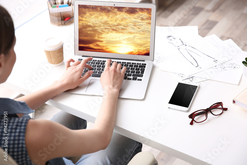 Woman working at computer at office