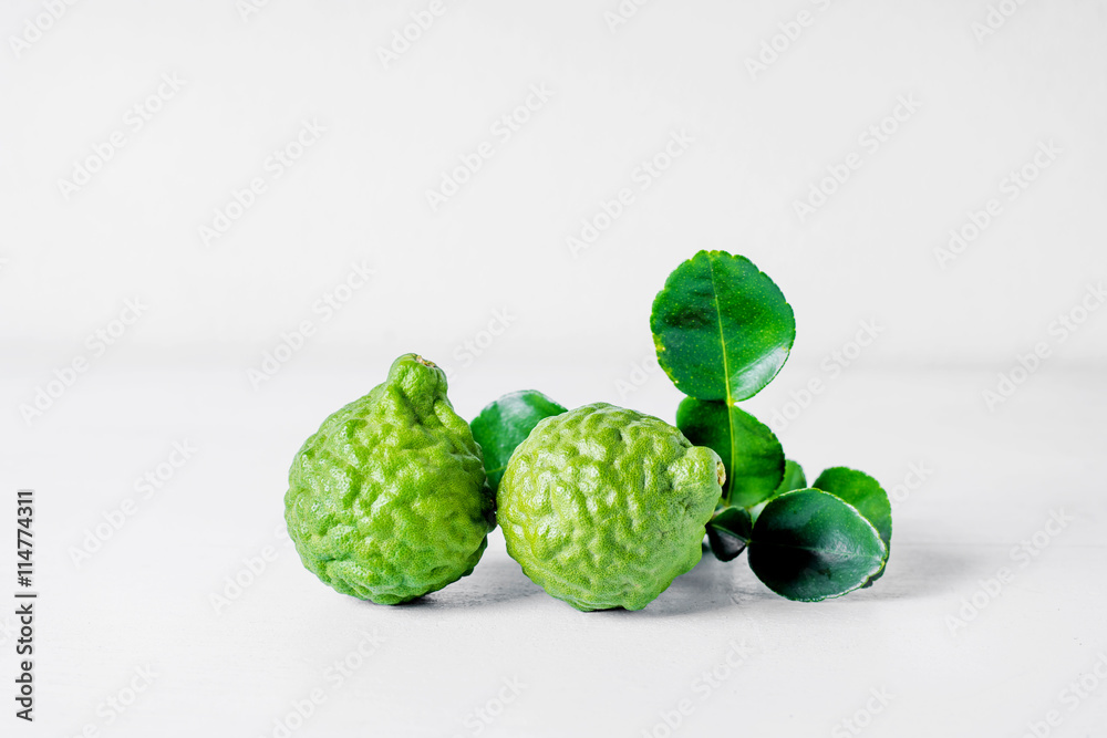 Fototapeta premium Bergamot fruit on white wooden background .