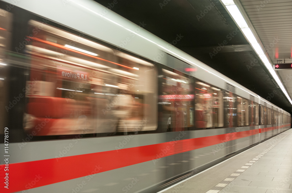 Moving train on subway station Moving train on subway station