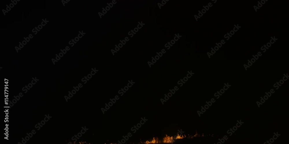 A large gasoline explosion rising in a smoke-darkened fiery cloud. A large gasoline explosion rising in a smoke-darkened fiery cloud.