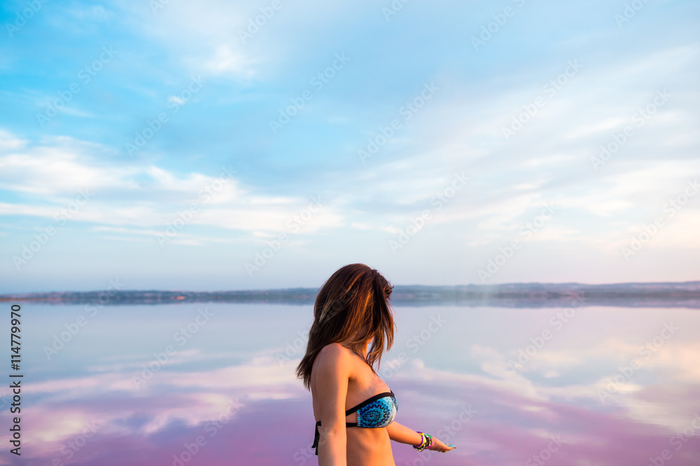 Pretty woman in a colorful lake