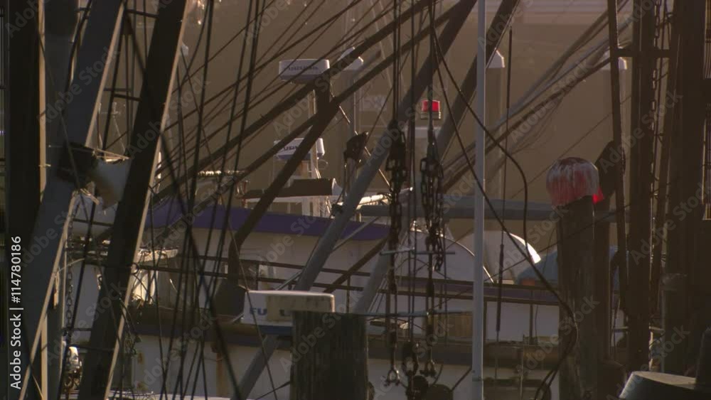 Full-frame rigging of fishing boats in a harbor Full-frame rigging of fishing boats in a harbor