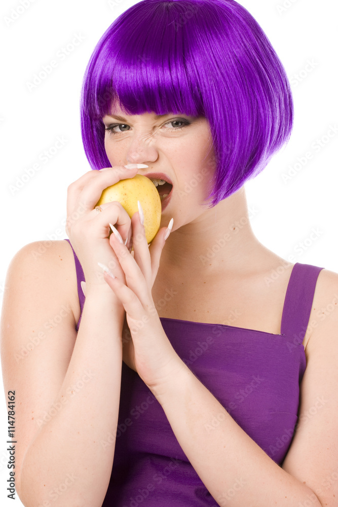 woman in wig with yellow apple woman in wig with yellow apple