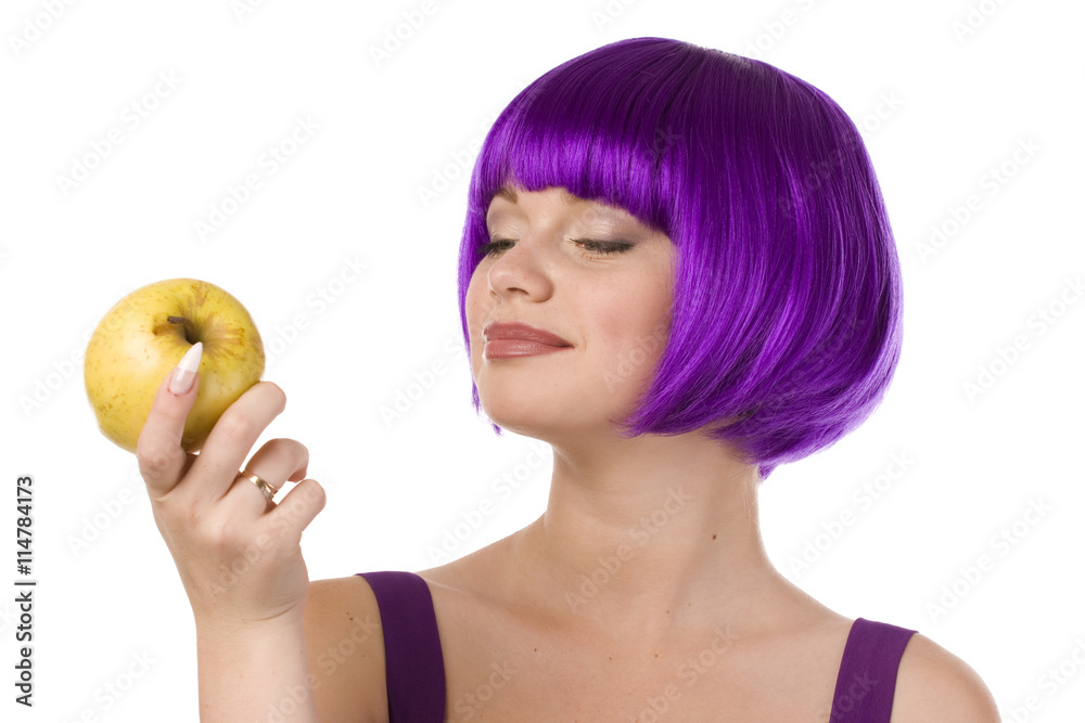 woman in wig with yellow apple woman in wig with yellow apple