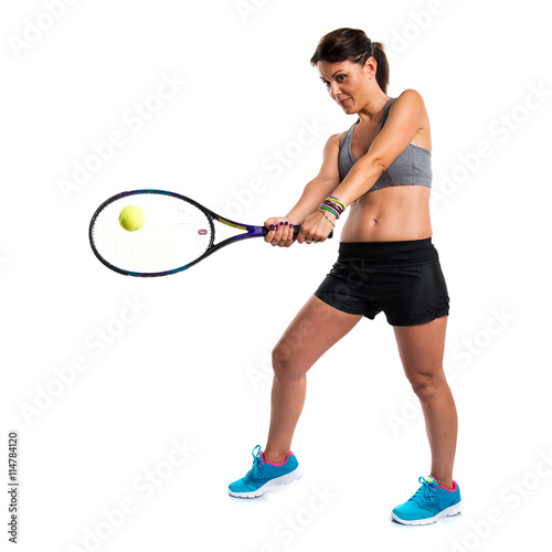 Pretty woman playing tennis © luismolinero